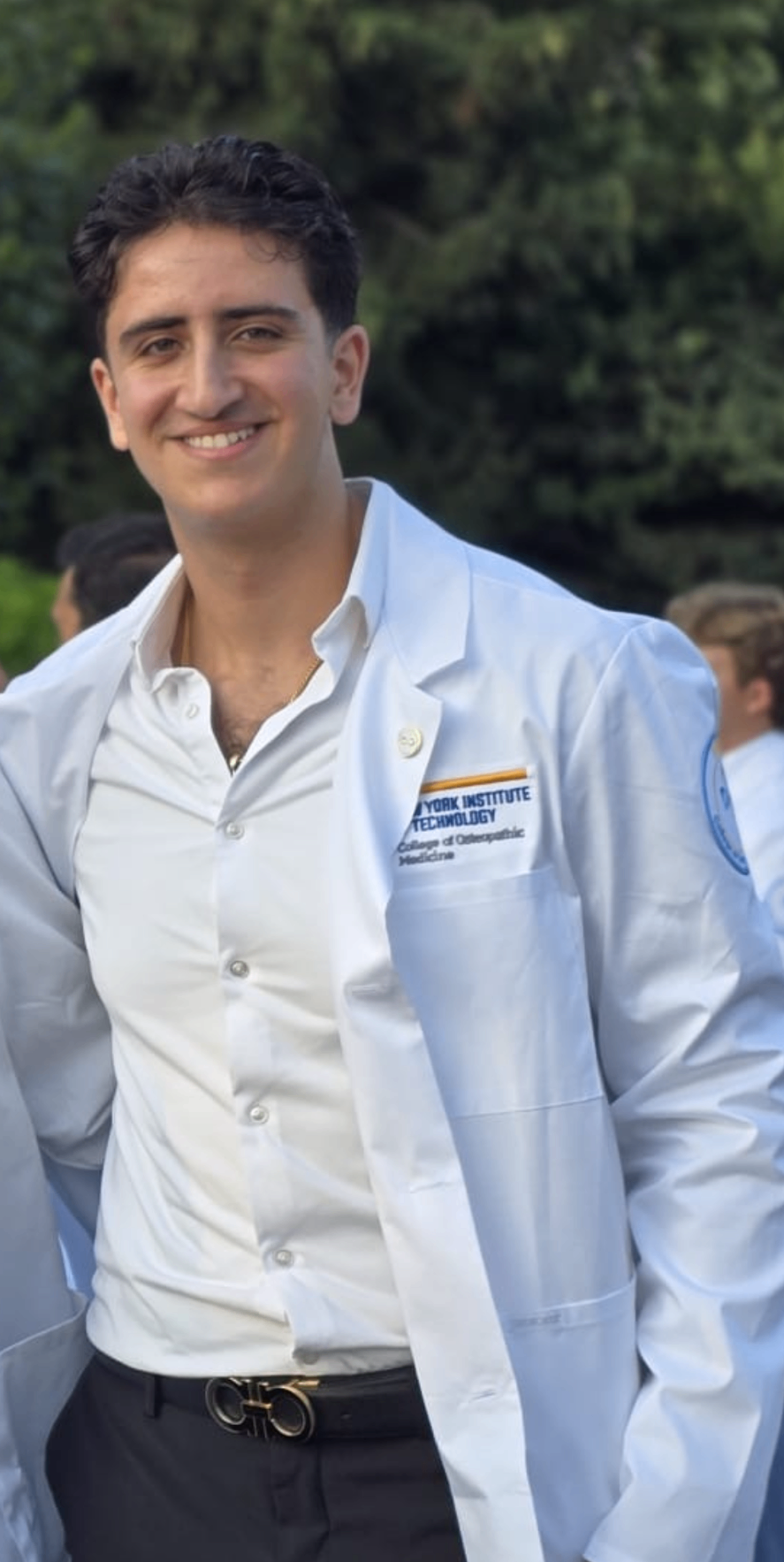 Founder of Tutorly Tutoring, a medical student, in a white coat